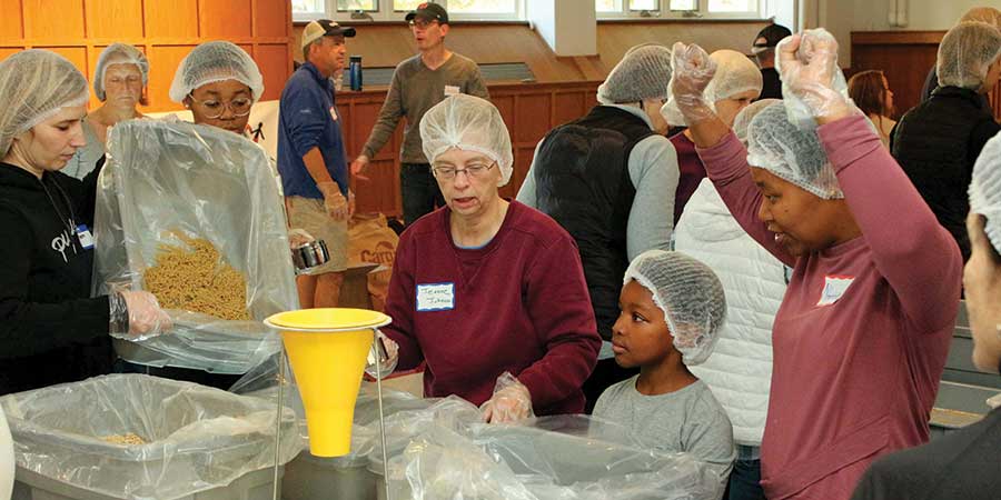 People packing meals